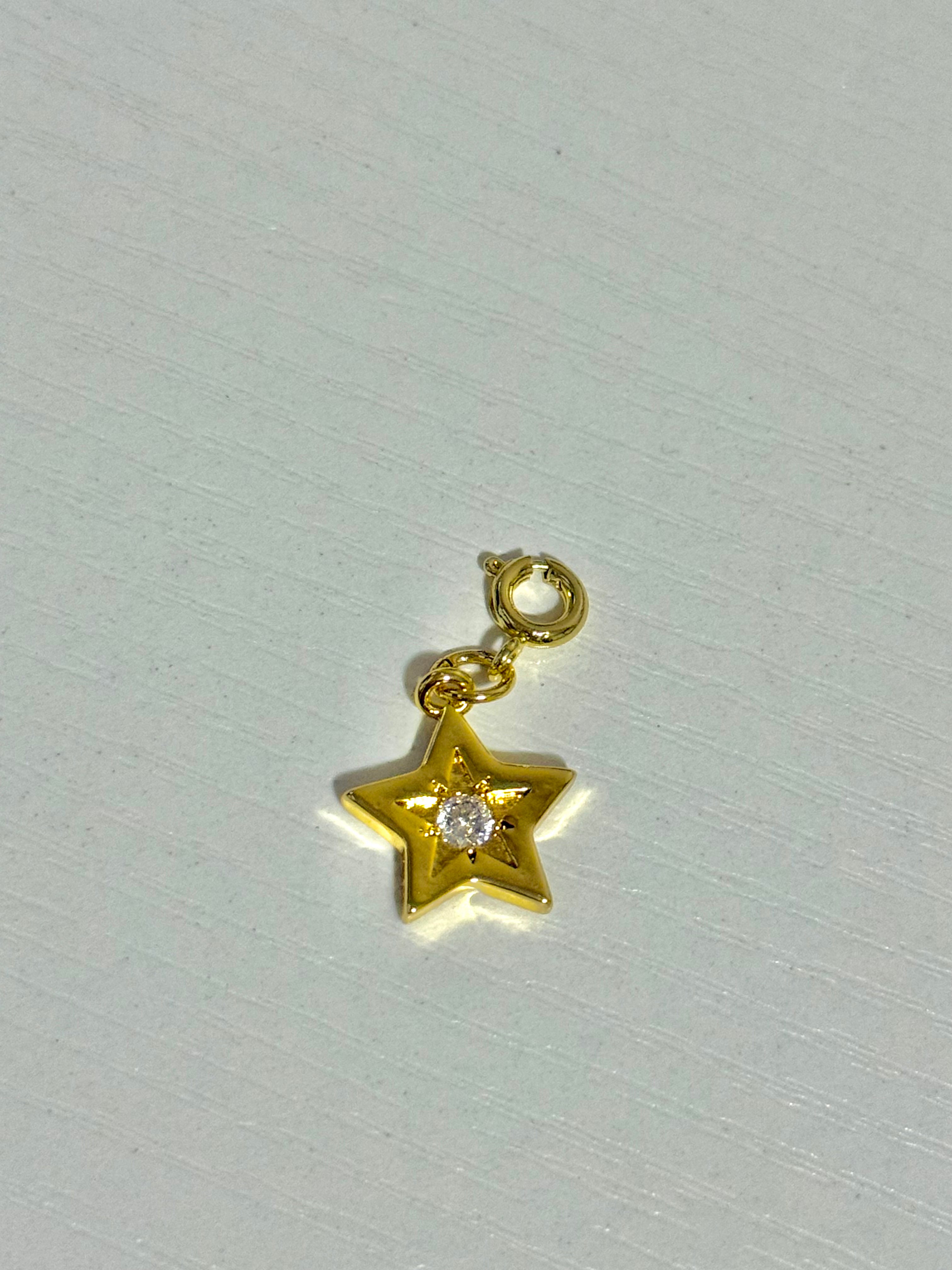 Gold Star Charm with a Rhinestone Center