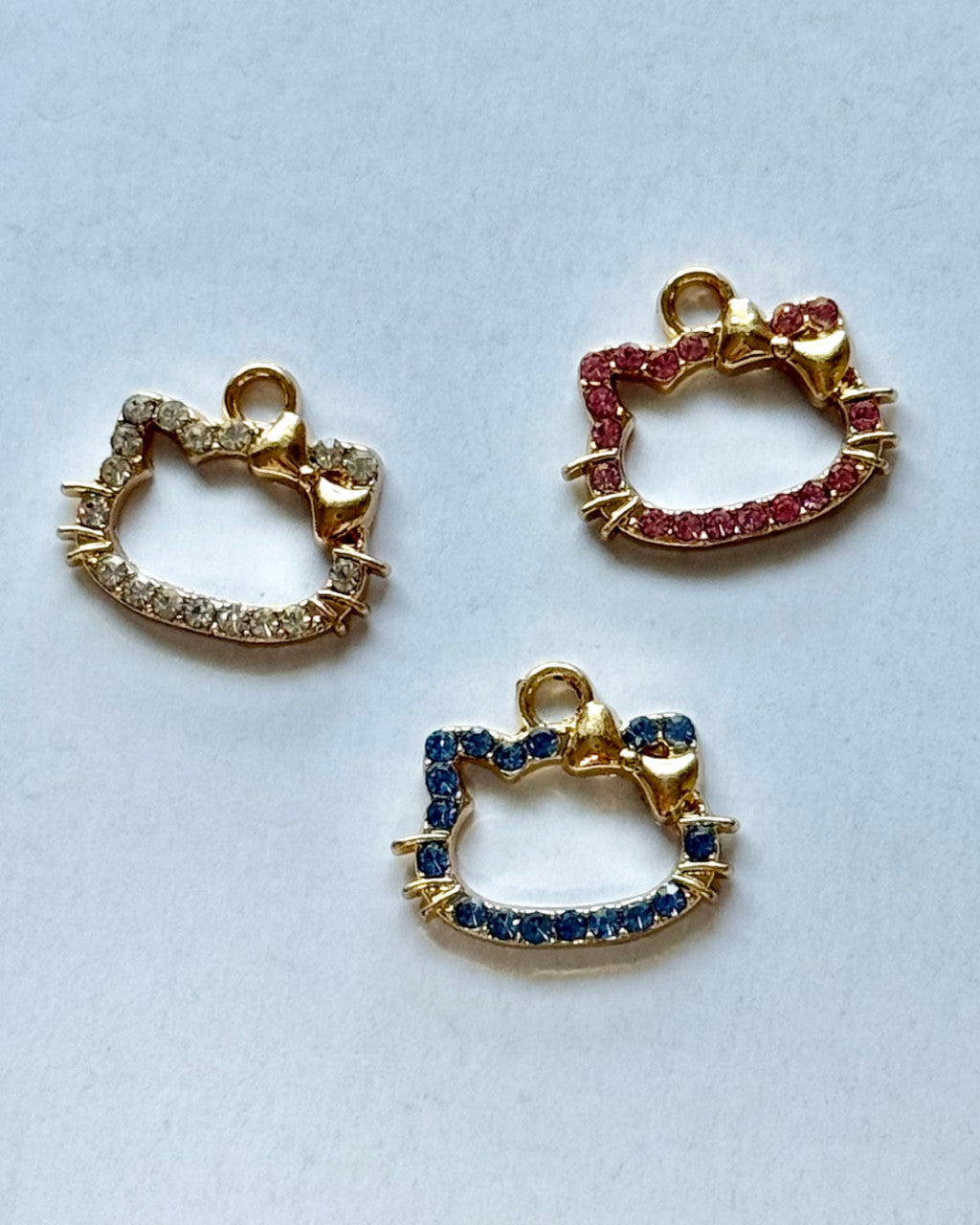 Gold Gemstone Cat with a Bow Charm